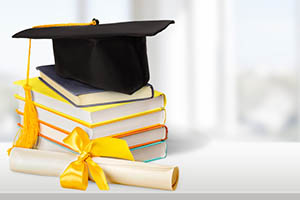 Mortar board and books